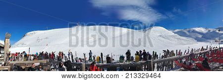 Paradiski, France - January 7, 2014: Ski resort bar and slopes aerial panorama, France, French Alps