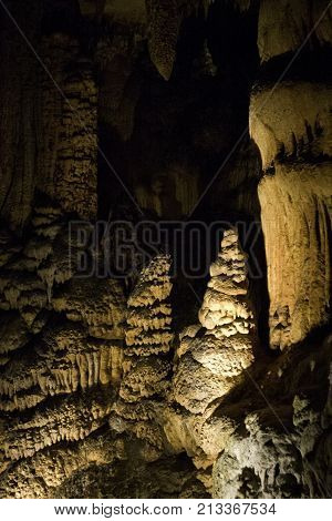 Vertical close up view of the amazing cavern speleothems mostly stalactite stalagmite formations with warm lighting at the Luray Caverns, Virginia located in the Shenandoah Valley.