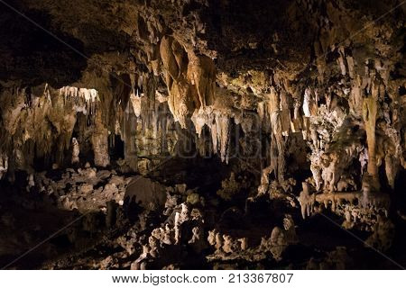 Wide landscape view of the amazing cavern speleothems mostly stalactite stalagmite formations with warm lighting at the Luray Caverns Virginia located in the Shenandoah Valley.