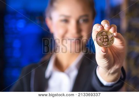 coin bitcoin cryptocurrency hold hand blured female