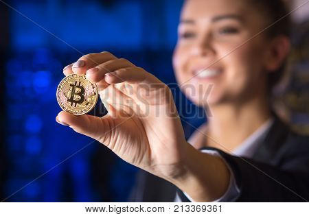 coin bitcoin cryptocurrency hold hand blured female