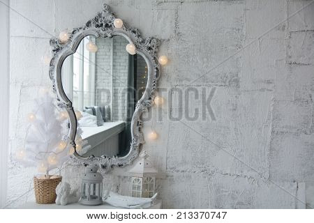Mirror In An Old Frame And A White Christmas Tree