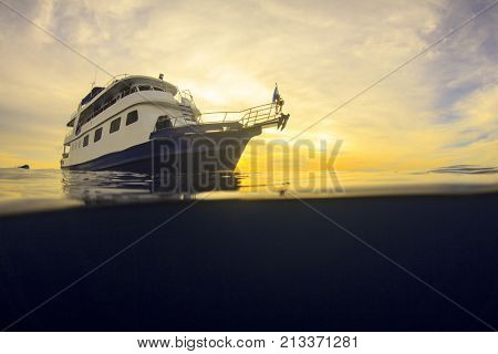Scuba diving liveaboard boat at sunset