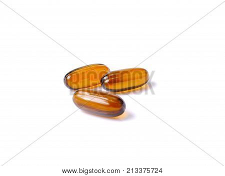 Vitamin Omega-3 fish oil capsules on white background brown capsules medicine