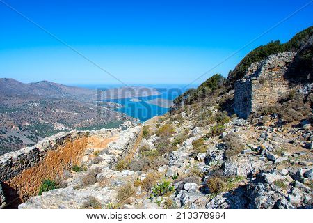 Panoramic view of the gulf of Mirambello with Spinalonga island. View from the mountain of Oxa with ruins of ancient water tanks, Crete, Greece.