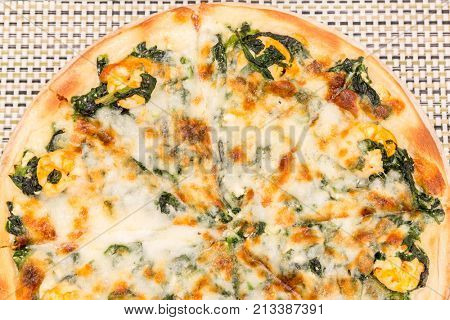 Pizza with shrimp and baked spinac
