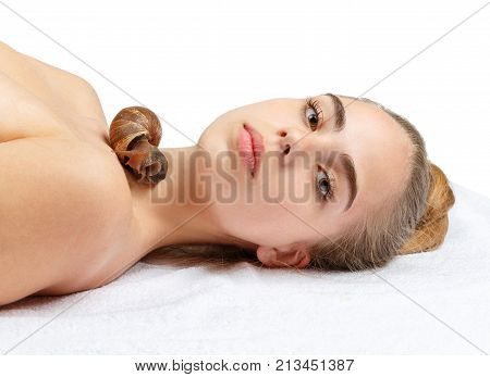 Ahatina on the neck of a young, beautiful girl on a white isolated background