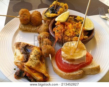 Mixed tapas platter in spain with paella
