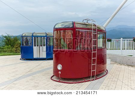 Red and blue cable cars. Retro technology and transportation theme.