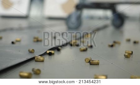 Huge Number Of Shell Casings From Bullets Lying On The Floor In The Room. Terrible Shooting Indoors 