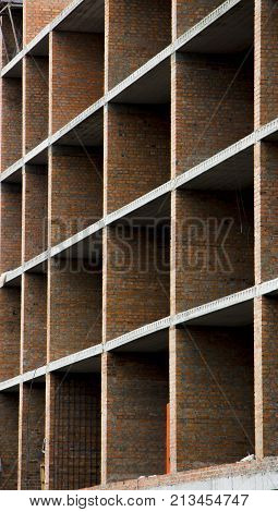 Floors. Fragment of the wall of the unfinished building.