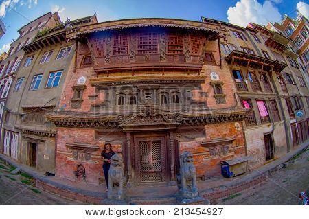KATHMANDU, NEPAL OCTOBER 15, 2017: A building facade with brick wall of the historical building near Patan Durbar Square, Kathmandu, Nepal.