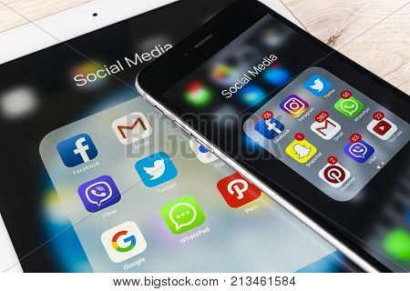Sankt-Petersburg Russia November 13 2017: Apple iPhone 7 and iPad pro with icons of social media facebook instagram twitter snapchat application on screen. Smartphone Starting social media app.
