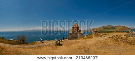 Sevan, Armenia - 02 AUGUST 2017: Tourists visiting the famous Sevanavank Monastery Landmark on the scenic Lake Sevan in Armenia.