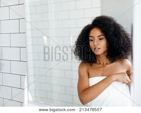 Shot of a attractive woman prepairing for her morning beauty routine in bathroom