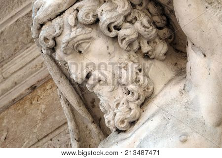 MANTUA, ITALY - JUNE 04: Statue of Hercules at the entrance to the 18th century Palazzo Vescovile (Bishops Palace) in the historical center of Mantua, Italy on June 04, 2017.