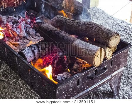 making Turkish kebabs, making cag kebabs, cooking meat on barbecue