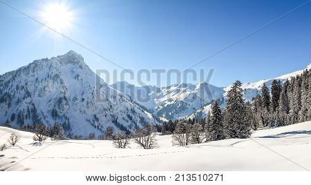 Snow mountains winter landscape on sunny day. Allgaeu Alps, Bavaria in Germany.