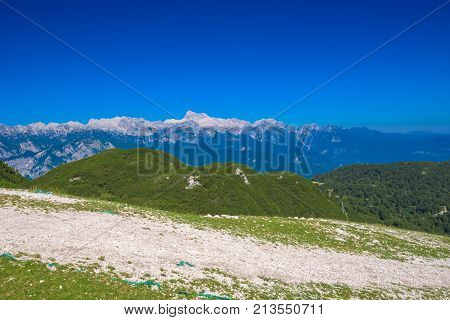 Mountainscape on sunny summer day with Triglav mountain peak in background