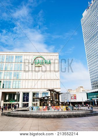 Fountain And Shops On Alexanderplatz In Berlin