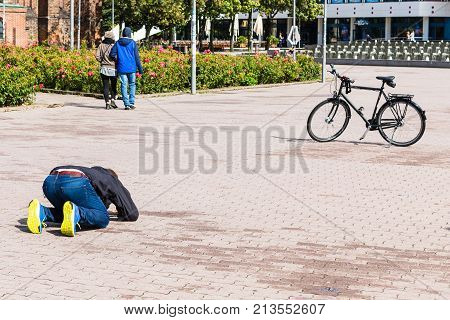 Man Takes Photo Of Bicycle In Berlin
