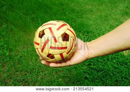 Man hold rattan ball for serve on his game