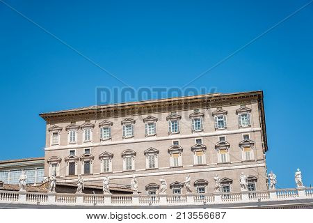 Rome, Italy - August 22, 2016:  Apostolic Palace in the Vatican from the  Square against blue sky