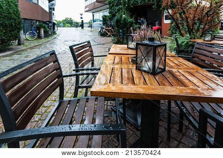 Empty Wooden Wet Table In Outdoor Cafe
