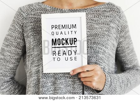 Woman holding a photo frame mockup
