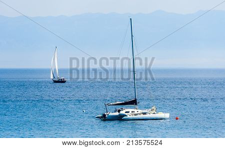 Catamaran Is Moored In Calm Sea Of Adriatic Sea.