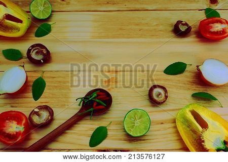 Background of vegetables and herbs for cooking on wood board top view for copy space