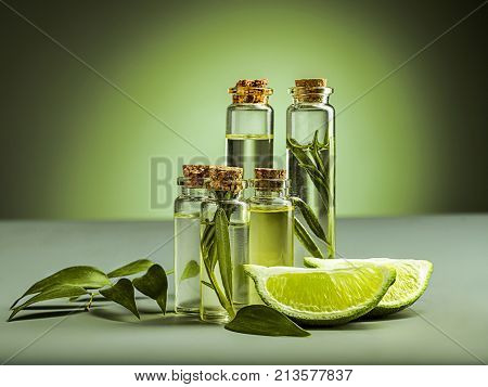 The lime oil on green studio background on table