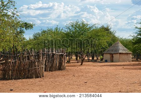 Traditional african hut in himba tribe village Namibia