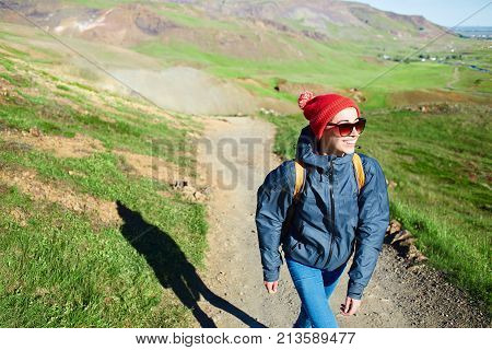 woman traveler on a walk in the Valley of the river of Hveragerdi Iceland. Hiking Tour of Reykjadalur Hot Springs