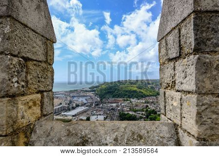 Dover Castle Kent UK - August 18 2017: View from the top of the castle wall. Aerial shot of the surrounding countryside and dock.