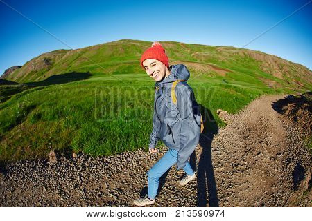 woman traveler on a walk in the Valley of the river of Hveragerdi Iceland. Hiking Tour of Reykjadalur Hot Springs