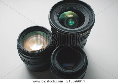 Close-up View Of A Group Of Camera Lenses On A White Surface
