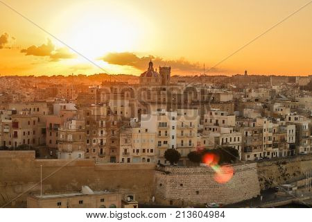 malta valletta at sunrise with golden light , historic background and landscape of the city