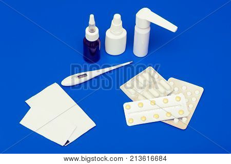 Medications, Pills And A Thermometer On A Bright Background