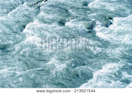 background texture: a stormy stream of water in a mountain river