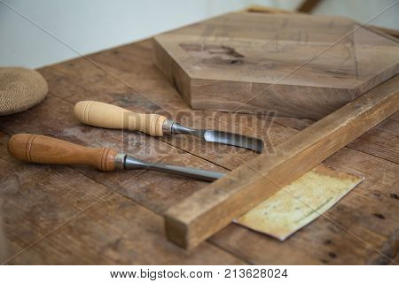 Marquetry Tools For Carver on Wooden Plank.