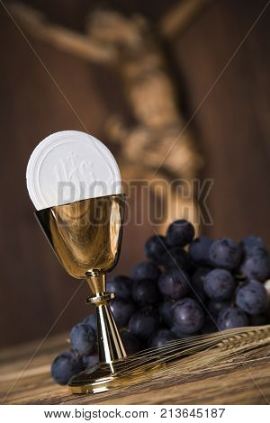 Eucharist symbol of bread and wine, chalice and host, First communion background