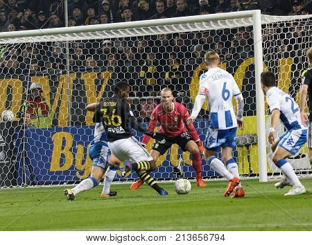 SOLNA SWEDEN - OCT 30 2017: Soccer player Goitom shoting the ball on the goal in the game between AIK and IFK Gothenburg. October 30 2017SolnaSweden
