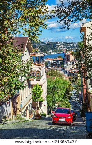 View of typical street from the hilltop of Kuzguncuk district with view of Bosphorus and Bosphorus Bridge