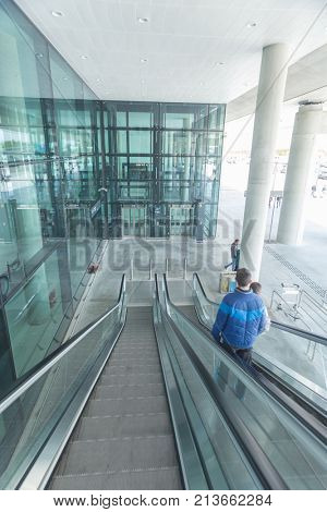 ZAGREB AIRPORT - 24 APRIL 2017: Passengers on escalators at Franjo Tudjman airport