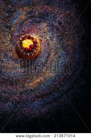 Galaxy. Star Dust. Confectionery product. Multicolored. Sugar and powdered sugar. Abstract background. Sweet food. Kuglof. dessert