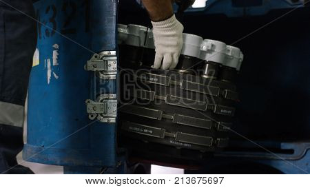 Calm Workers Controlling Aircraft Machine. Aircraft Maintenance Mechanic Inspects Plane Chassis. Eng