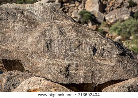 Closeup of petroglyphs etched in rocks in Arizona