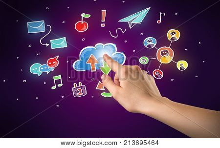 Female hand toucing mixed media icons with purple background
