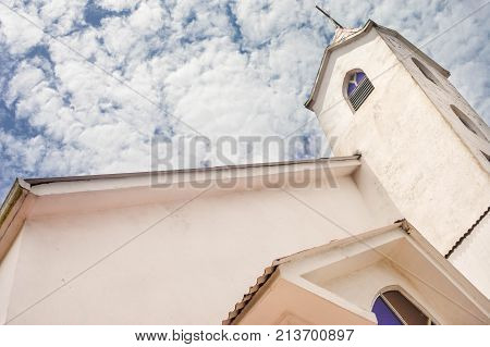 Protestant Moravian church with blue sky and clouds on the background in Bluefields Nicaragua. Central America